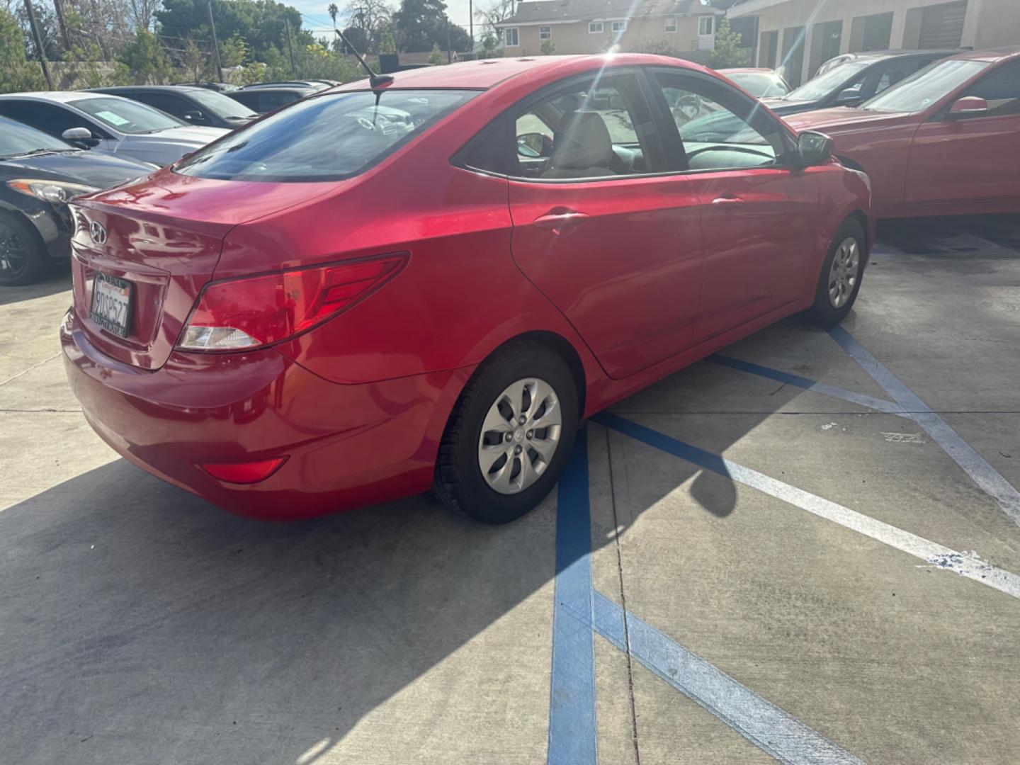 2015 Red /Gray Hyundai Accent GLS Sedan 4D (KMHCT4AE2FU) with an 4-Cyl, 1.6L engine, Auto, 6-Spd w/Overdrive transmission, located at 30 S. Berkeley Avenue, Pasadena, CA, 91107, (626) 248-7567, 34.145447, -118.109398 - The 2015 Hyundai Accent 4-Door Sedan stands as a testament to Hyundai's commitment to quality, efficiency, and value. Located in Pasadena, CA, our dealership specializes in providing a wide range of used BHPH (Buy Here Pay Here) cars, trucks, SUVs, and vans, including the remarkable Hyundai Accent. - Photo#5